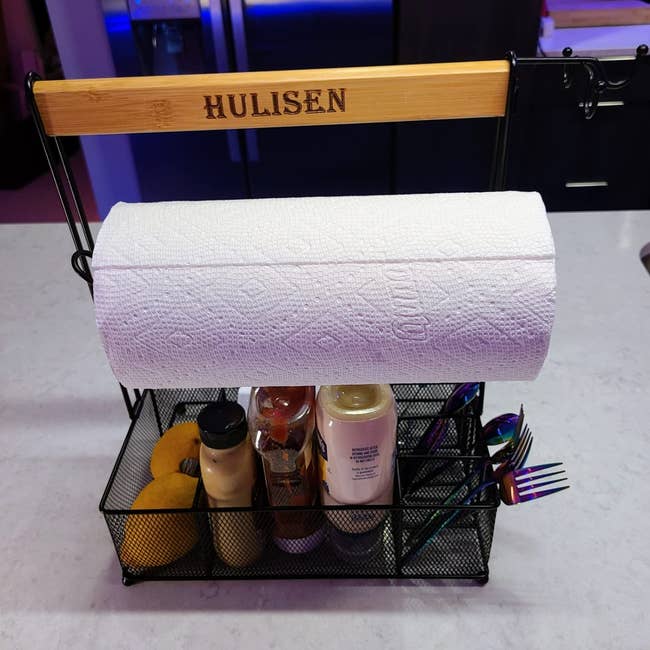 Organizer with paper towel holder, condiments, and cutlery