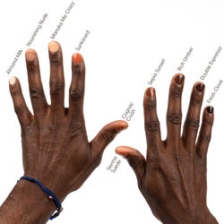 model with dark skin showing off all the colors on their fingers