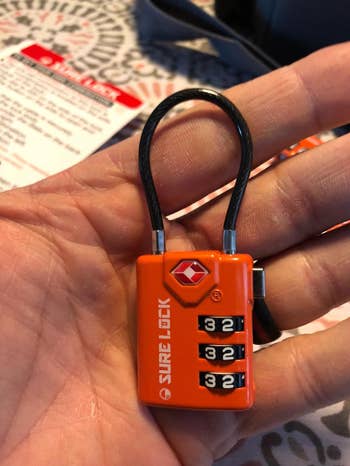 a reviewer holding the orange lock