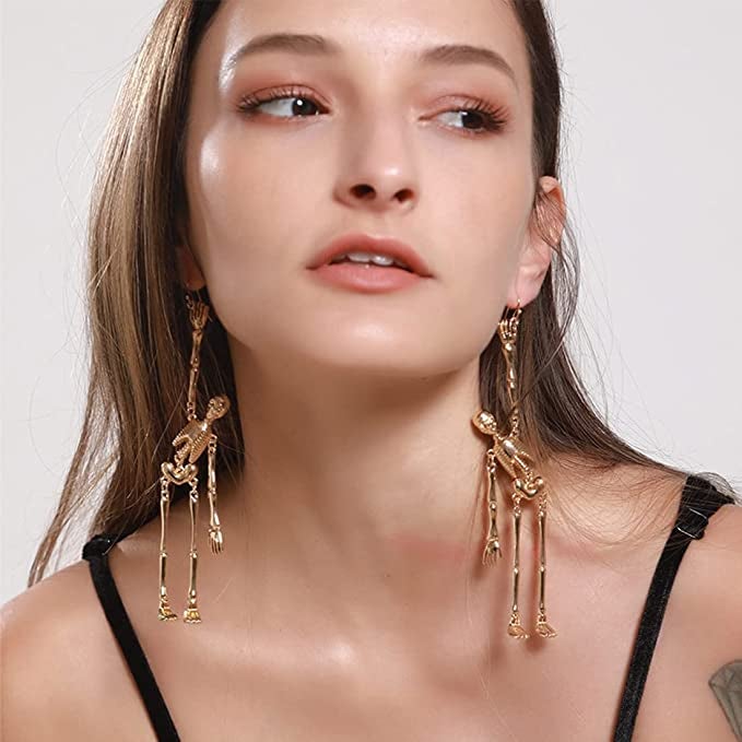 model wearing the earrings in gold