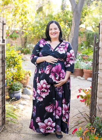reviewer posing in floral maxi dress