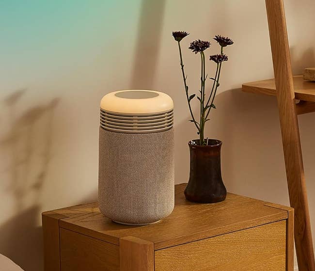 Bedside array with a mini sunrise alarm timepiece and aerial purifier. Text highlights the merchandise arsenic a broad steadfast slumber solution