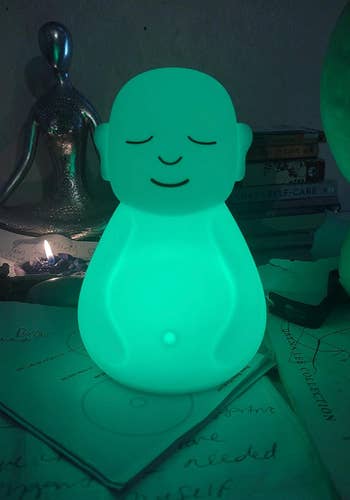 The figurine glowing green 