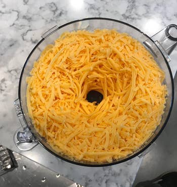 reviewer's overhead shot of cheese that was shredded using the food processor