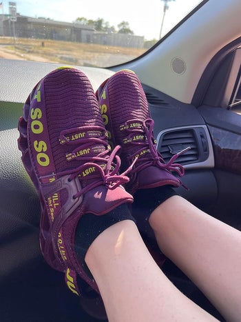 reviewer image of the sneakers in purple and yellow