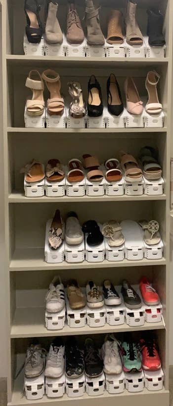a reviewer photo of a closet filled with shoes organized with the stackers 
