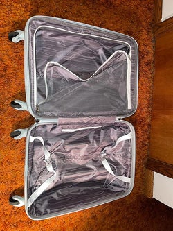 reviewer photo of suitcase interior pockets