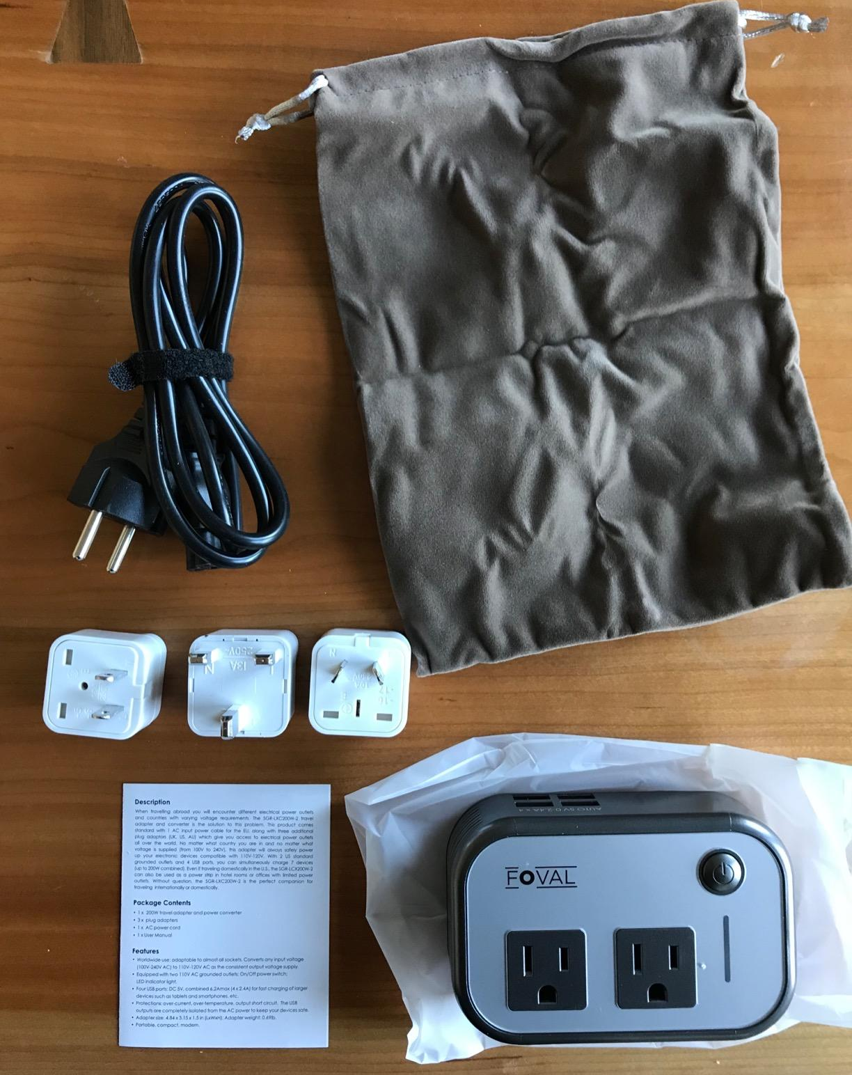 reviewer photo of the adapter and its included attachments, cord, instructions, and travel pouch