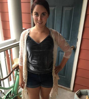 reviewer wearing grey velvet tank with shorts and a cardigan