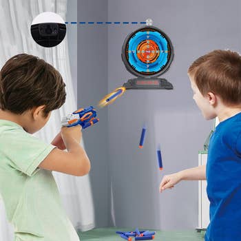 two model children shooting at the dart board