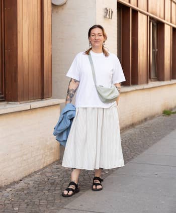 Store subordinate wearing the t-shirt successful achromatic with an oversized relaxed fit