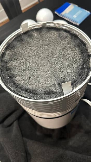 Small aerial  purifier with a blackened filter 