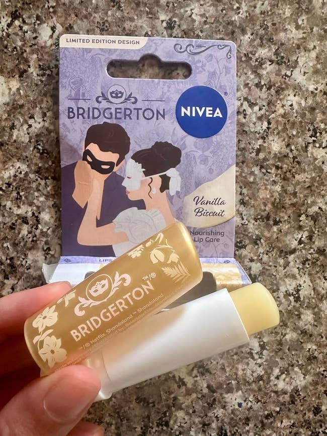 Close-up of a manus holding a Bridgerton-themed Nivea Vanilla Biscuit nourishing articulator attraction merchandise packaging