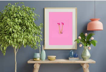 The pink digital print with girl with pink heels framed and hanging on a wall