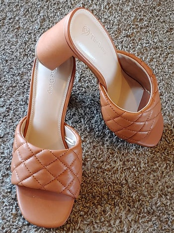 the brown quilted style block mules