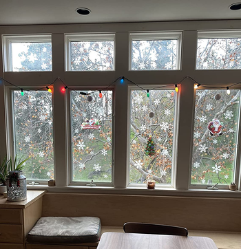 reviewer photo of the snowflake decals on four windows