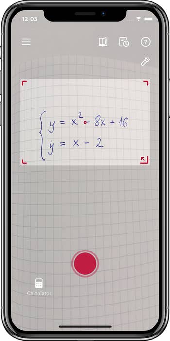 a product shot of someone taking a photo of a math problem via the app