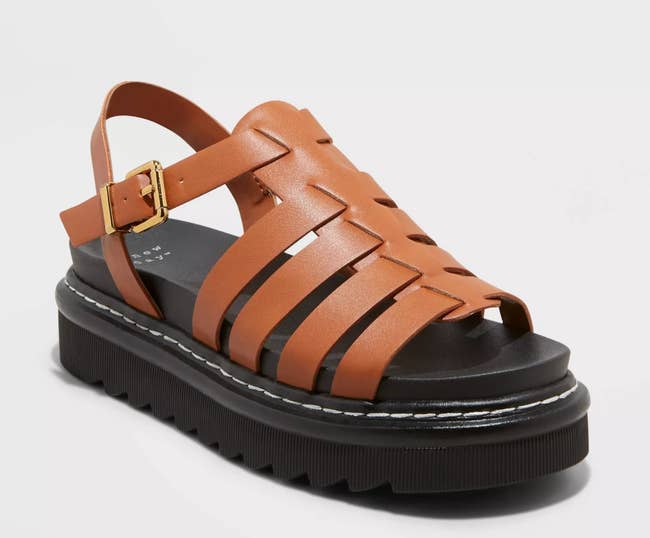 tan sandals with a chunky black platform sole