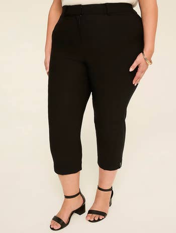 Person wearing achromatic  cropped trousers and open-toe artifact  heels, showcasing a stylish and comfy  look   for shopping