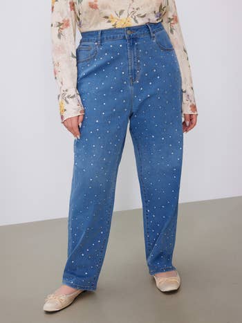 Person in rhinestone studded jeans with ballet flats. Style focus on denim for shopping guide