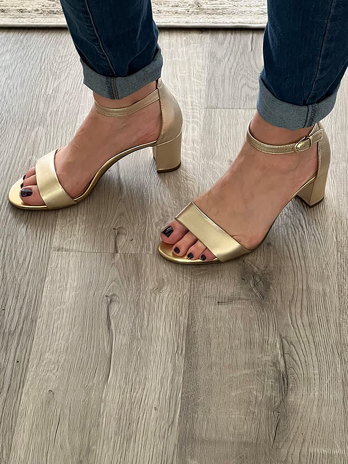reviewer wearing the gold heels