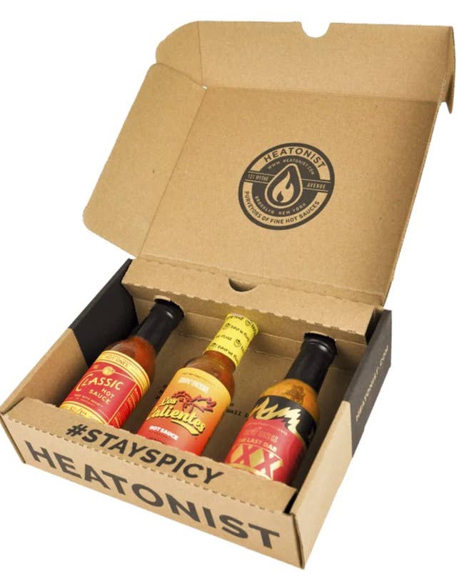 box containing three bottles of hot sauce