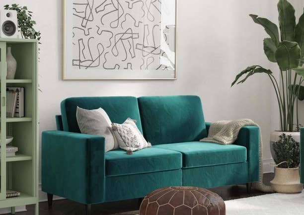 green velvet couch in living room