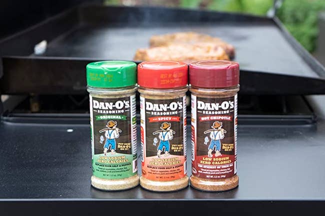 original, spicy, and hot chipotle seasonings on a grill