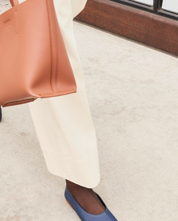 model wearing the navy flats