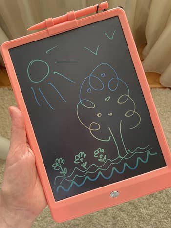 reviewer holding drawing tablet