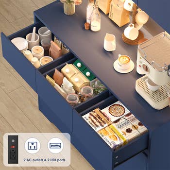Kitchen countertop with java  maker, assorted java  sachets, cups, and snacks. Nearby outlets and USB ports for convenience