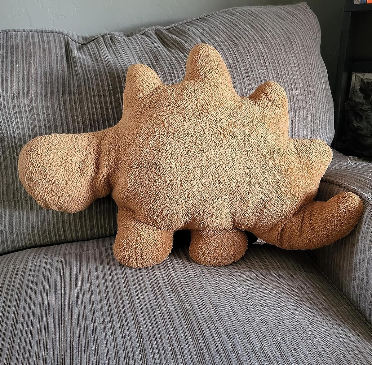 dino nugget pillow on reviewer's couch