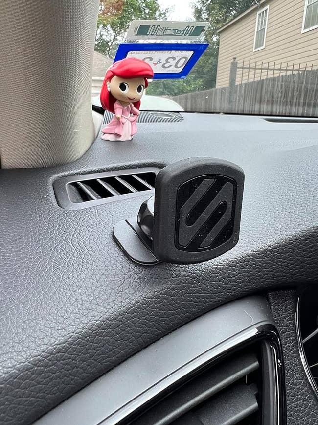 Car dashboard with a phone mount attached to it