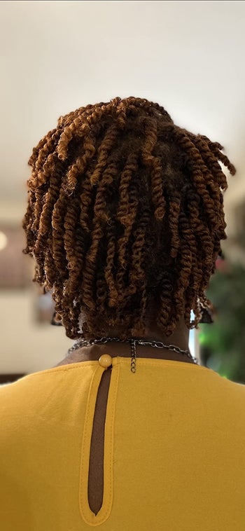 reviewer with 4c hair showing their natural twists