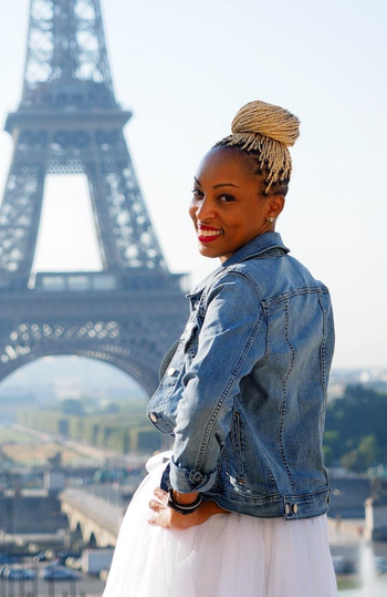 a reviewer poses in the jacket in Paris