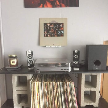 A record leans on the NOW SPINNING ledge
