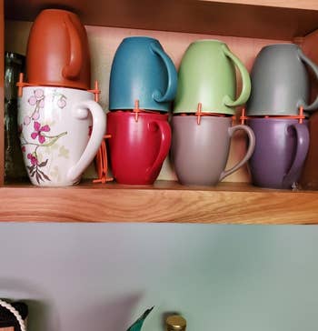 reviewer's mugs stacked on top of each using the orange organizers