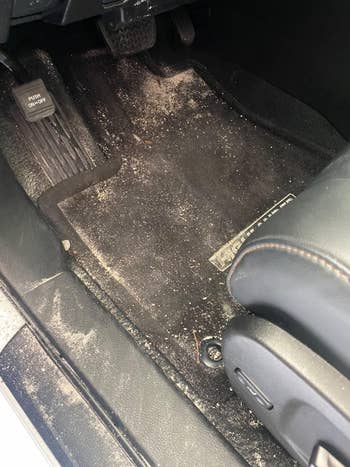 before image of a dirty car floor mat in need of cleaning