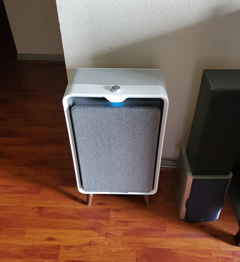 reviewer photo of an air purifier on their floor