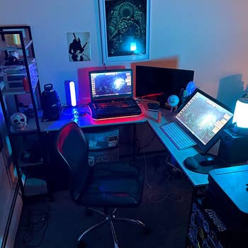 reviewer's desk with the 5 tier bookshelves with the lights off