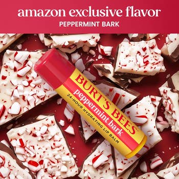 Burt's Bees Peppermint Bark Lip Balm surrounded by peppermint cocoa pieces, marked arsenic an Amazon exclusive flavor