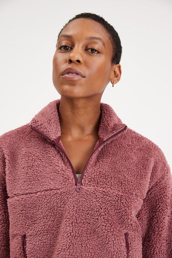 different model wearing the fleece in purple