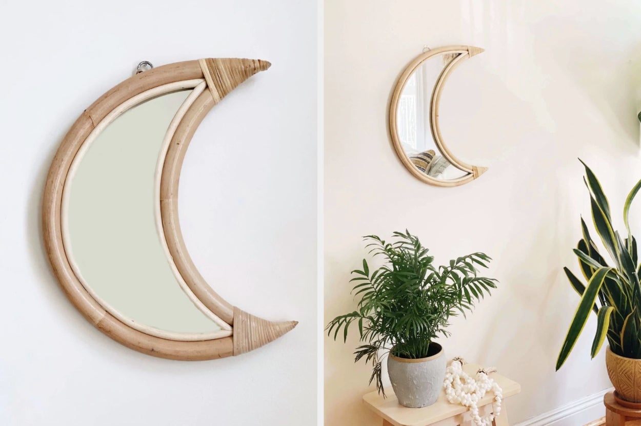 Moon-shaped mirror with wooden frame on a white background, product hanging on wall above plants