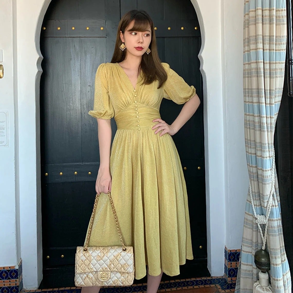 model wearing the dress in yellow
