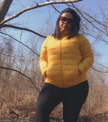 another reviewer wearing the yellow puffer