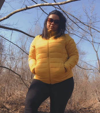 another reviewer wearing the yellow puffer