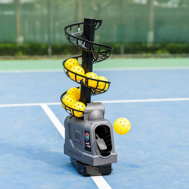 Tennis shot instrumentality connected a tribunal launching yellowish balls, showcasing an automatic signifier instrumentality perfect for players looking to amended their game