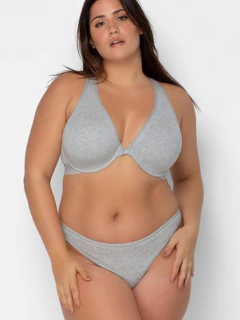 a model posing in the gray bra and matching underwear