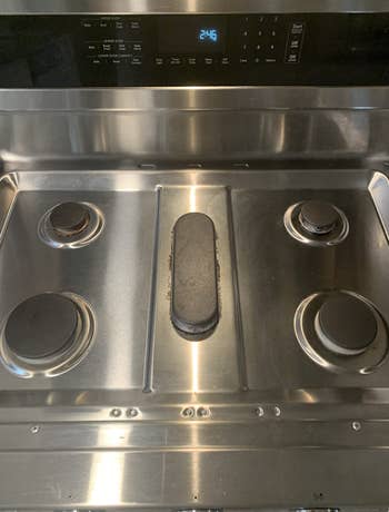 the same stainless steel stovetop looking clean
