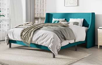lifestyle image of turquoise low profile upholstered bed